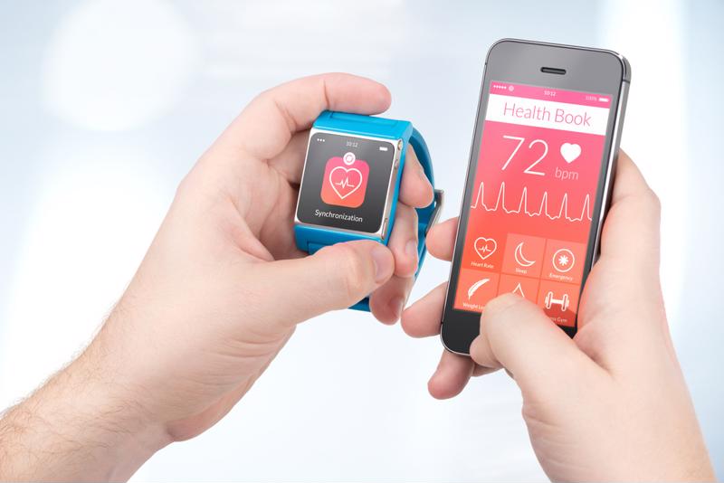 smart watch and phone app monitoring heart rate