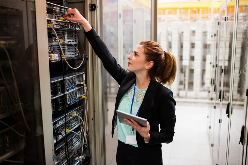 Woman checking a server room